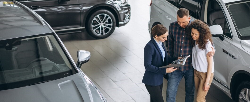 /images/young-couple-talking-sales-person-car-showroom_1303-15135.jpg